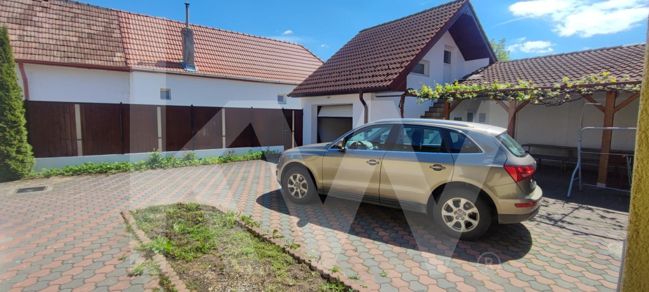 Casă de închiriat – 2 dormitoare, 100 mp utili + curte 220 mp, garaj, filigorie