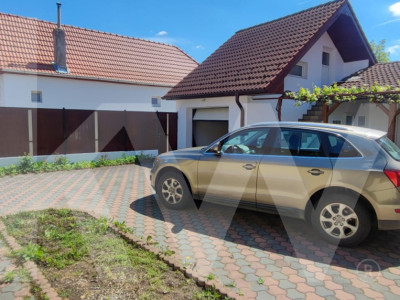 Casă de închiriat – 2 dormitoare, 100 mp utili + curte 220 mp, garaj, filigorie
