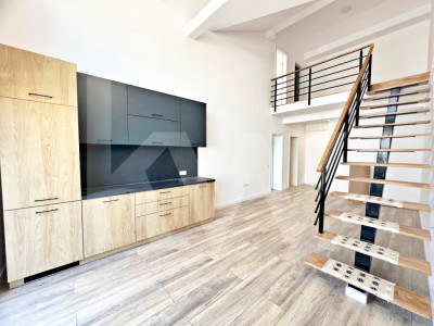 Apartament finisat la cheie cu 3 camere, bucătărie mobilată și două băi. 