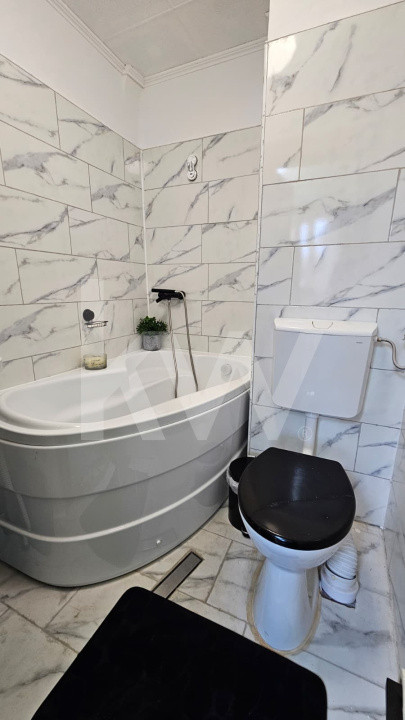 Casă individuală compusă din două apartamente, cu teren liber de 540 mp 