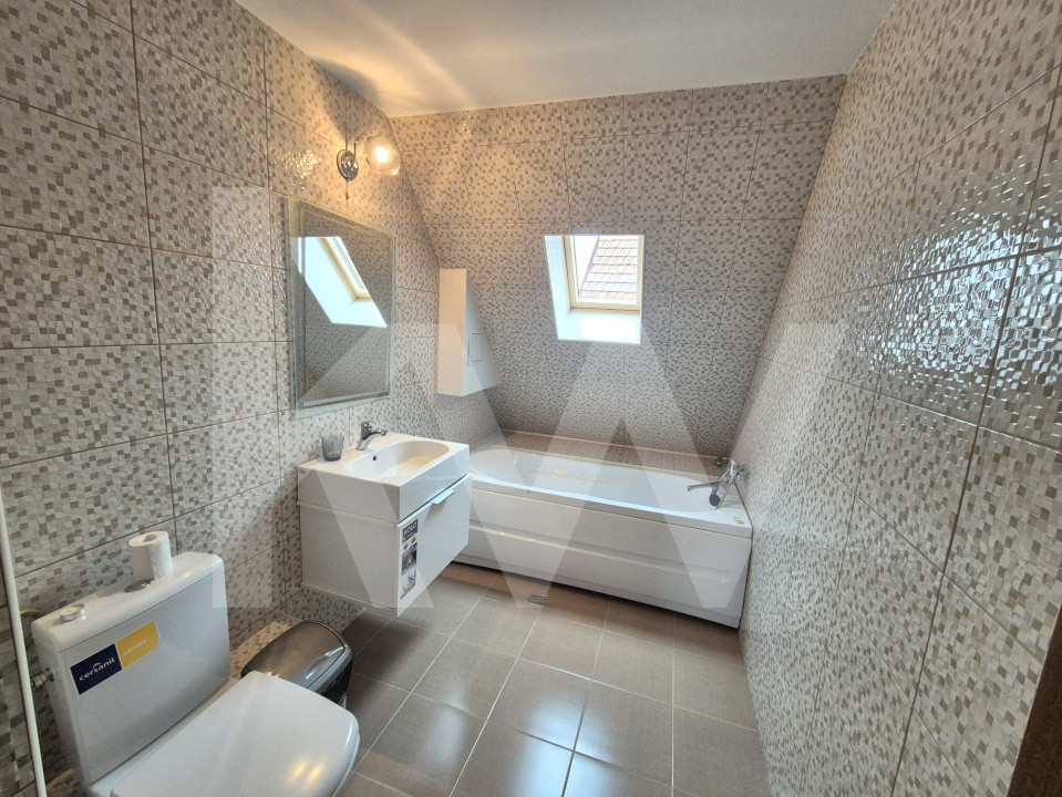 CASĂ INDIVIDUALĂ de închiriat – 330 mp, 8 camere, 5 băi, garaj dublu, grădină 