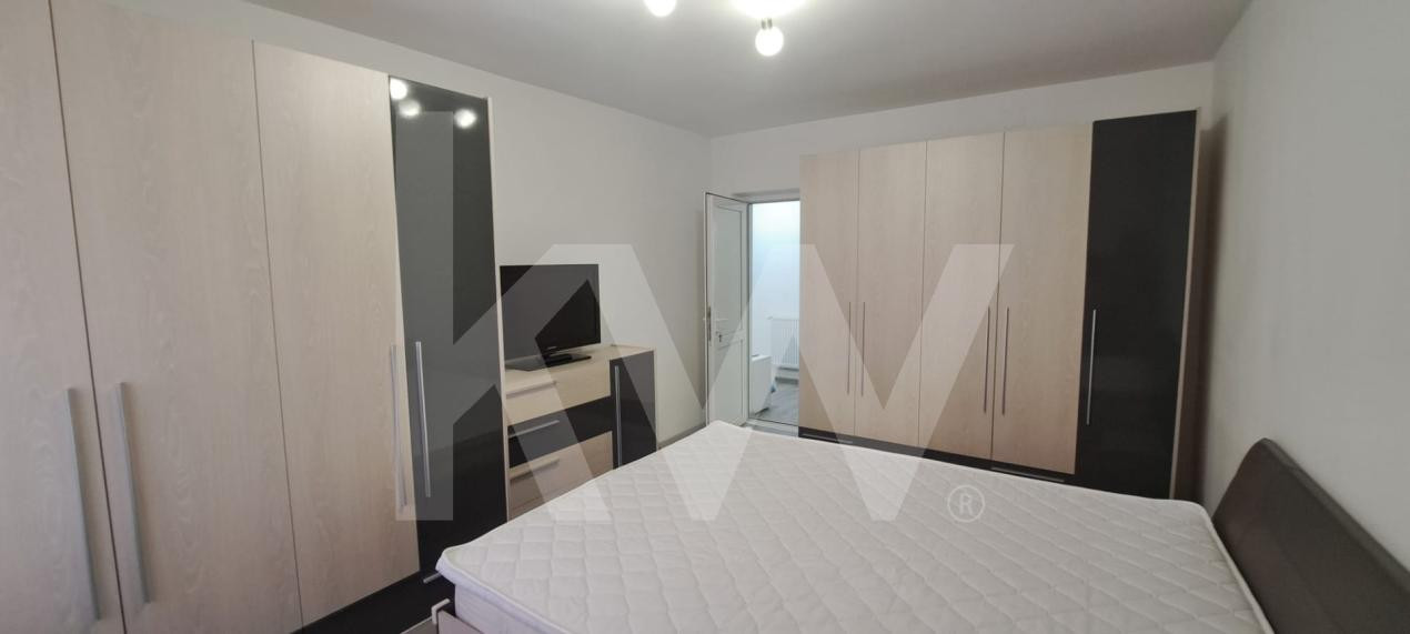 Apartament modern cu 2 camere, curte privată și 2 locuri de parcare