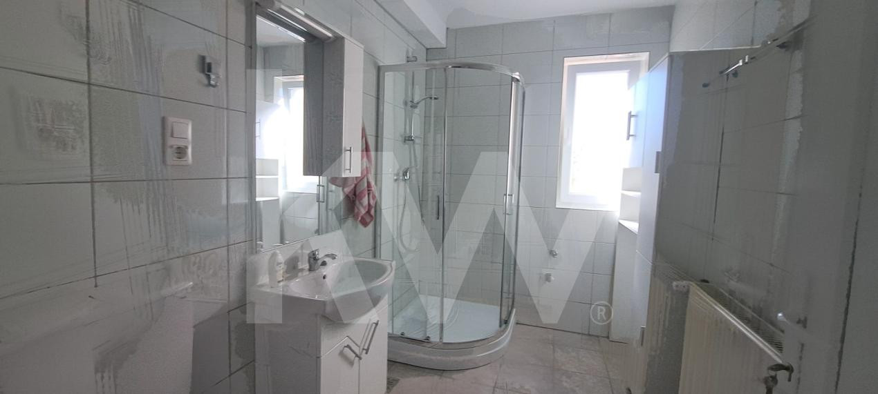Apartament modern cu 2 camere, curte privată și 2 locuri de parcare