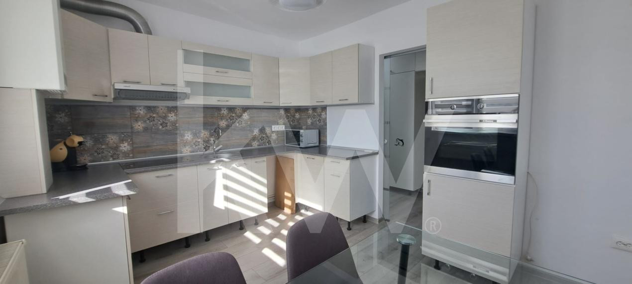 Apartament modern cu 2 camere, curte privată și 2 locuri de parcare