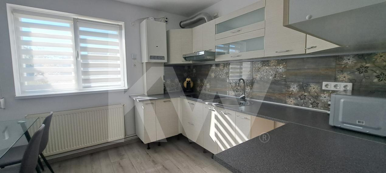 Apartament modern cu 2 camere, curte privată și 2 locuri de parcare