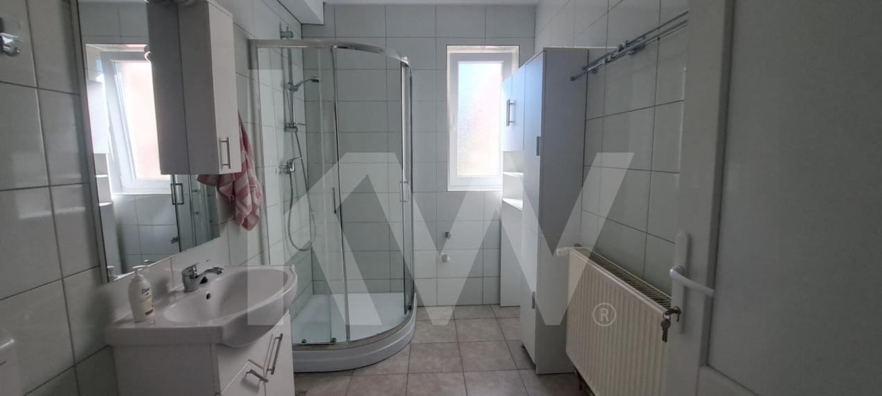 Apartament modern cu 2 camere, curte privată și 2 locuri de parcare