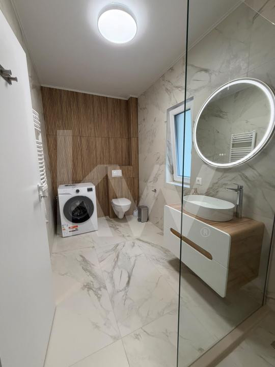 Apartament modern de 63 mp, cu 2 dormitoare și loc de parcare
